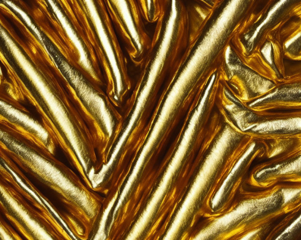 Textured golden surface with wavy patterns and deep grooves reflecting light.