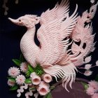 Intricate paper-crafted flower bouquet in shades of pink, white, and cream