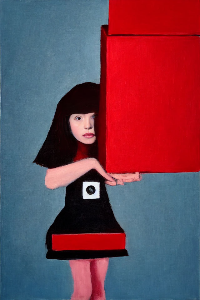 Young girl in black dress holding red square on blue backdrop