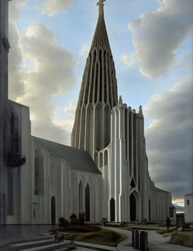 Gothic architecture church with pointed steeple under mixed sky