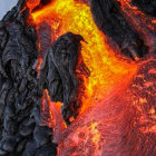 Winged figure in flowing robes against fiery volcanic backdrop