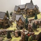 Fantasy village with cascading waterfalls and soft light