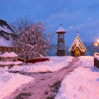 Snowy Village Scene with Rustic Houses and Barren Trees in Winter Afternoon Glow