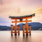 Iconic Vermilion Torii Gate at Itsukushima Shrine at Sunset