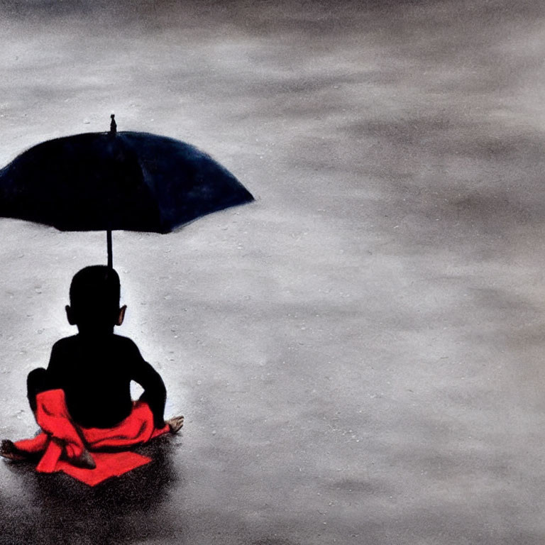 Child sitting under blue umbrella on gray surface in red garment