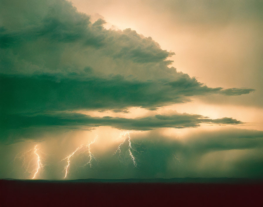 Intense thunderstorm with multiple lightning bolts against dark sky