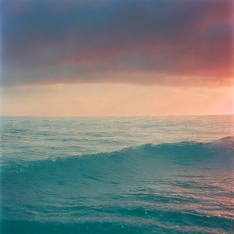 Vintage-Toned Ocean Waves at Sunset Sky Gradient