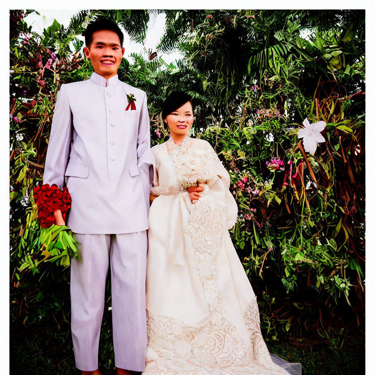 Formal Attire Couple Smiling in Greenery and Flowers