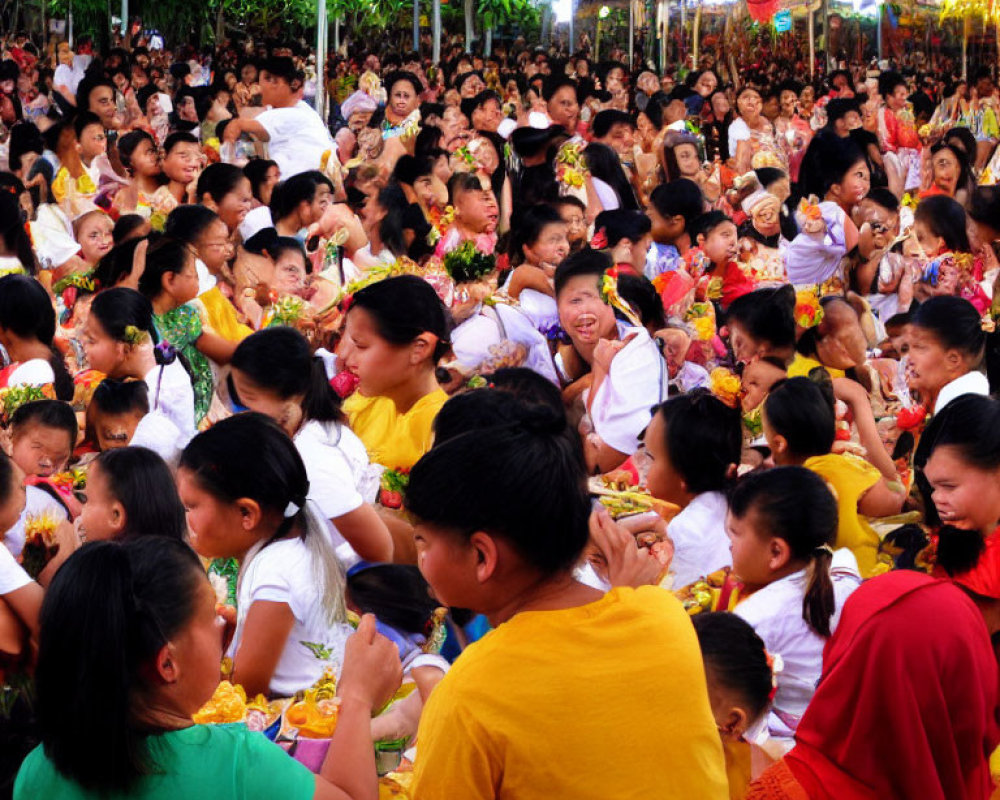 Crowd in Yellow Attire with Flowers at Festive Outdoor Event