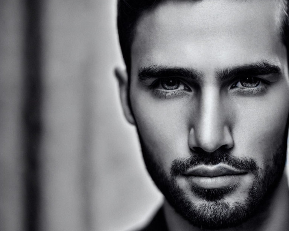 Monochrome close-up portrait of intense bearded man