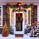 Festive Christmas decorations on snow-covered doorway