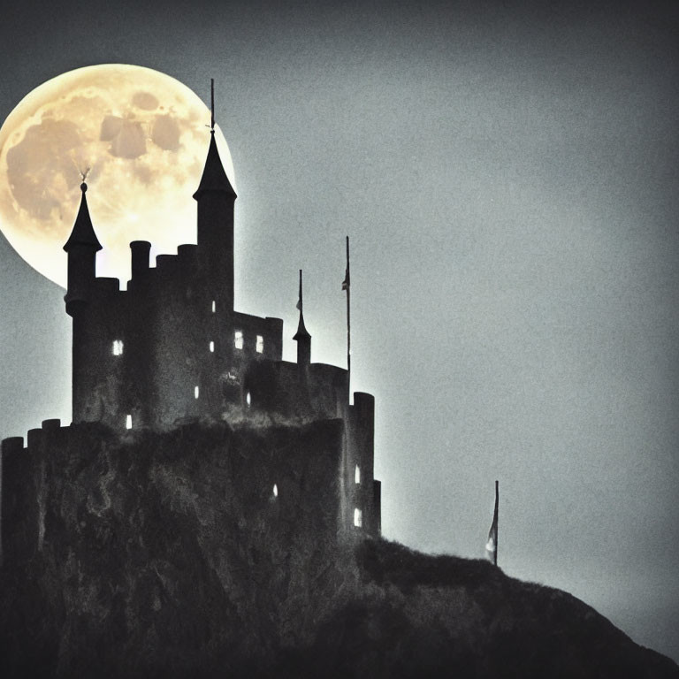 Silhouetted castle with turrets under full moon