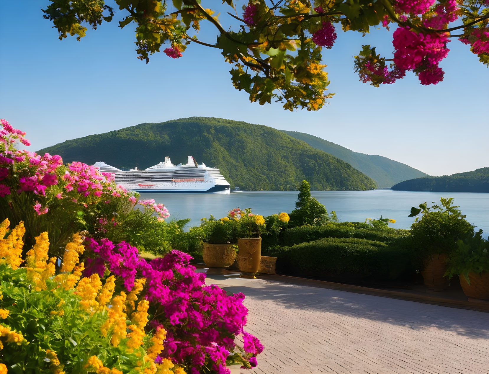 Cruise ship in serene bay viewed from vibrant garden