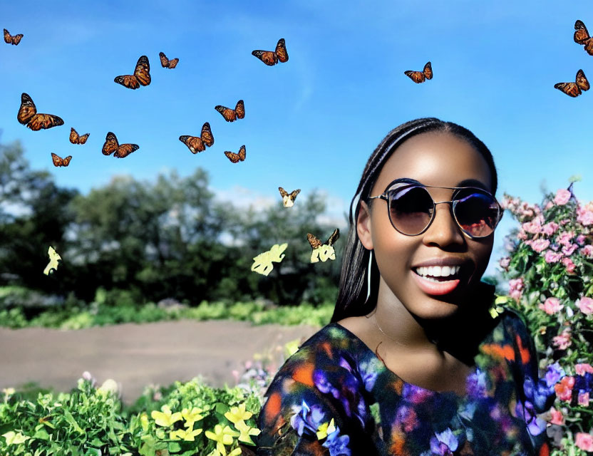 Smiling woman with sunglasses surrounded by butterflies and flowers