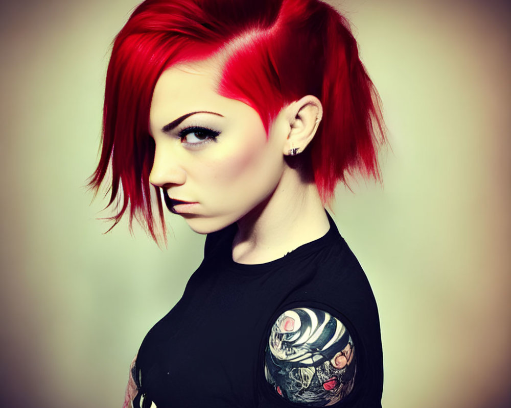 Serious person with red asymmetric hair and dark eyeliner in graphic black top