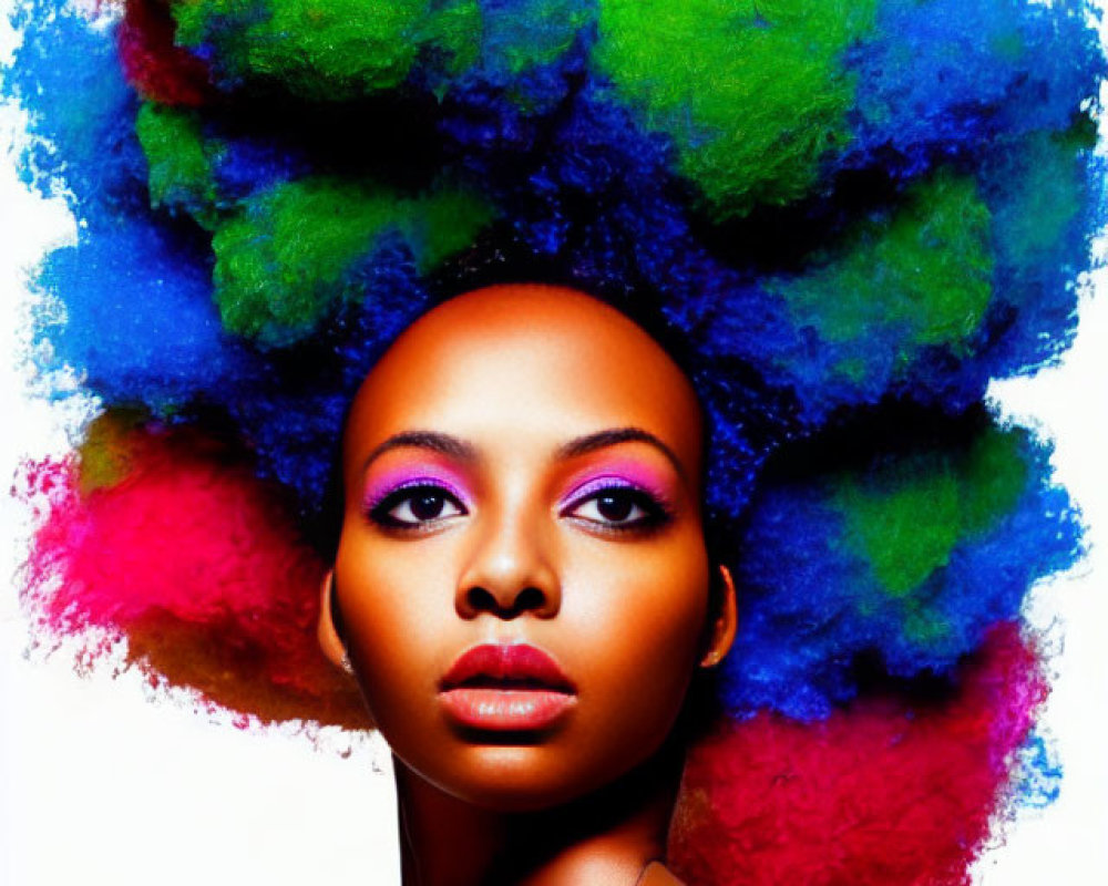 Portrait of woman with striking eyes and multicolored afro hairstyle