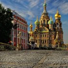 Traditional Russian church with onion domes in snow-covered street at twilight