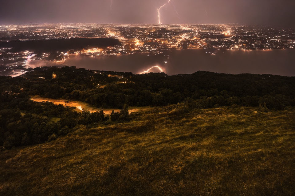 Dramatic nighttime cityscape with lightning strikes