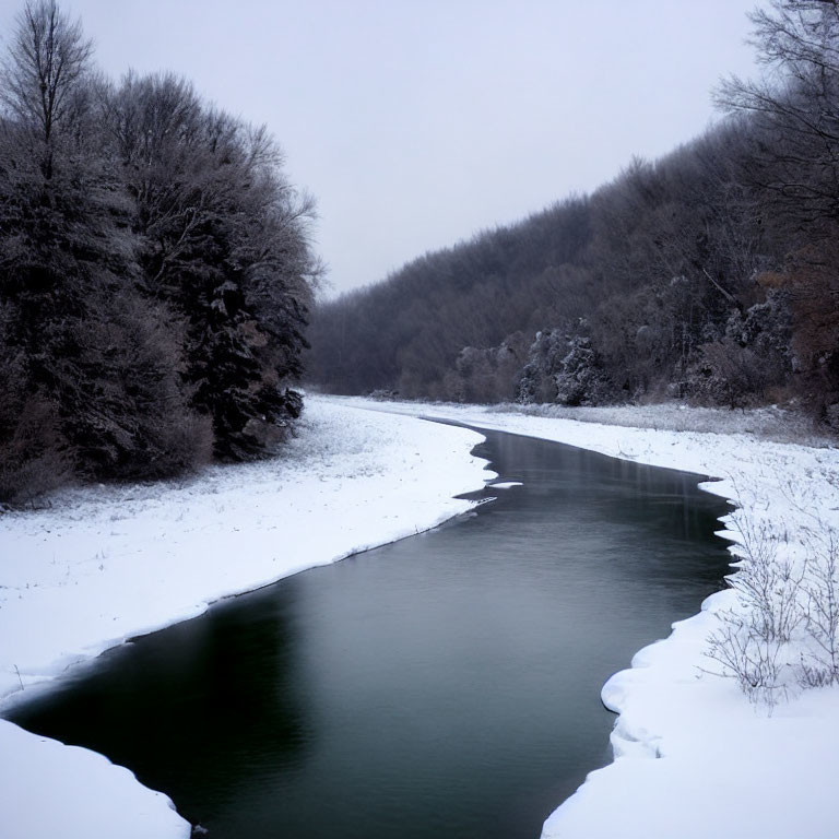 Tranquil winter landscape with frozen river and snow-covered trees