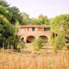 Scenic watercolor: Stone villa in green hills