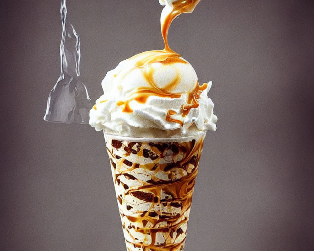 Melting caramel ice cream cone on gray background