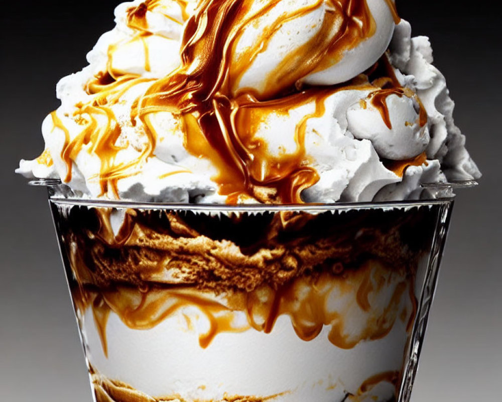 Caramel sundae with whipped cream and drizzled sauce in clear container