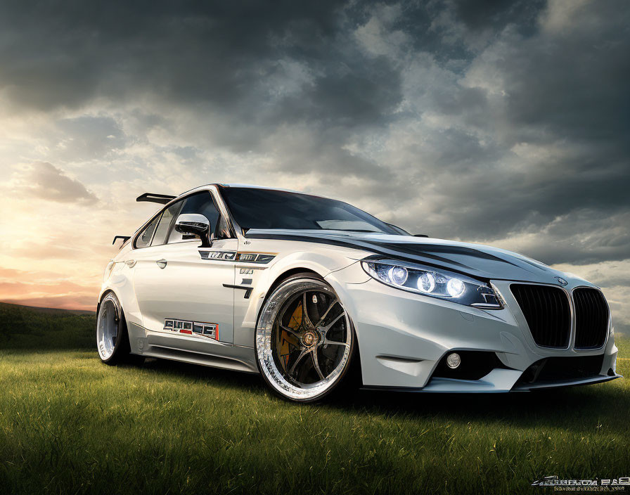 Modified white BMW with aftermarket body kit and wheels under dramatic sunset sky