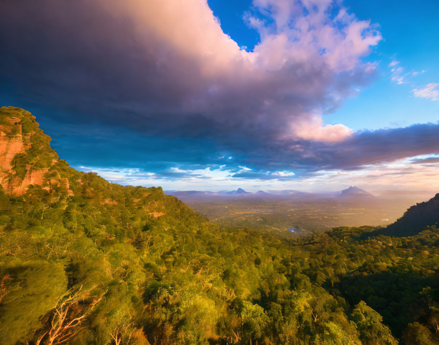 Dramatic sunset landscape with lush greenery and distant mountains