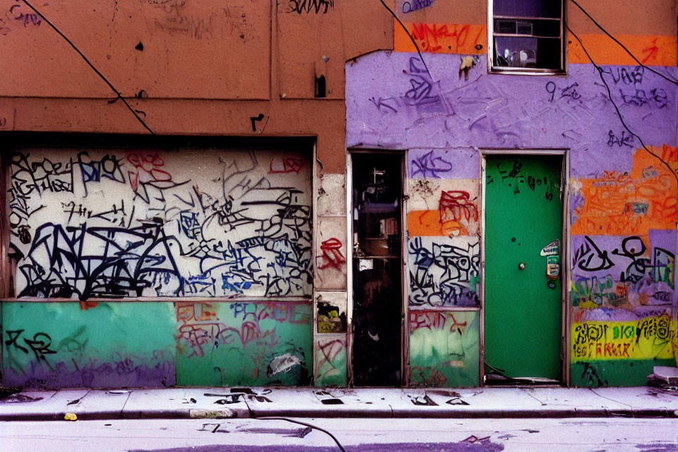 Colorful Graffiti-Covered Building Facade with Green Door