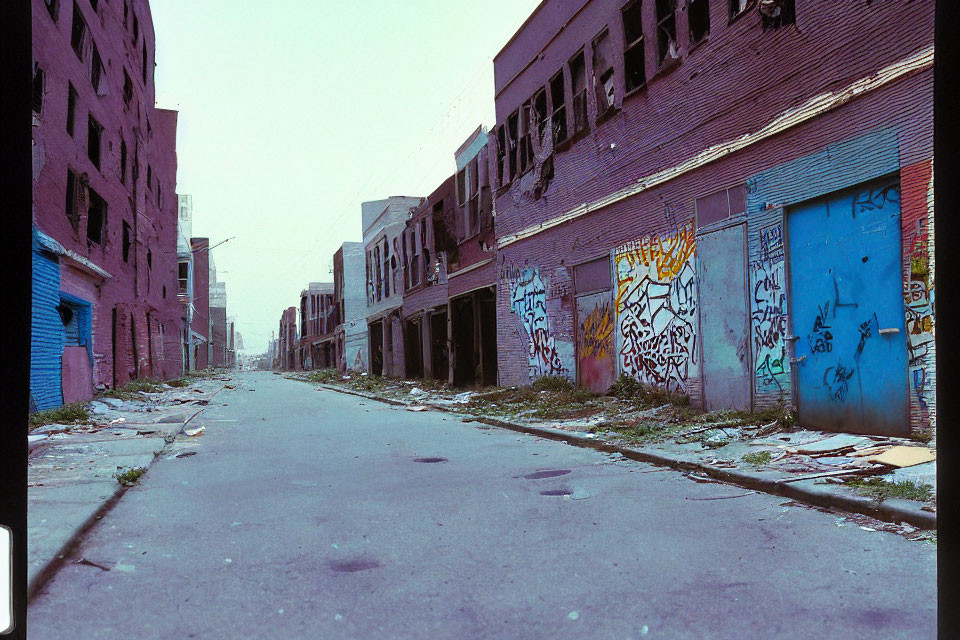 Abandoned urban street with graffiti and debris