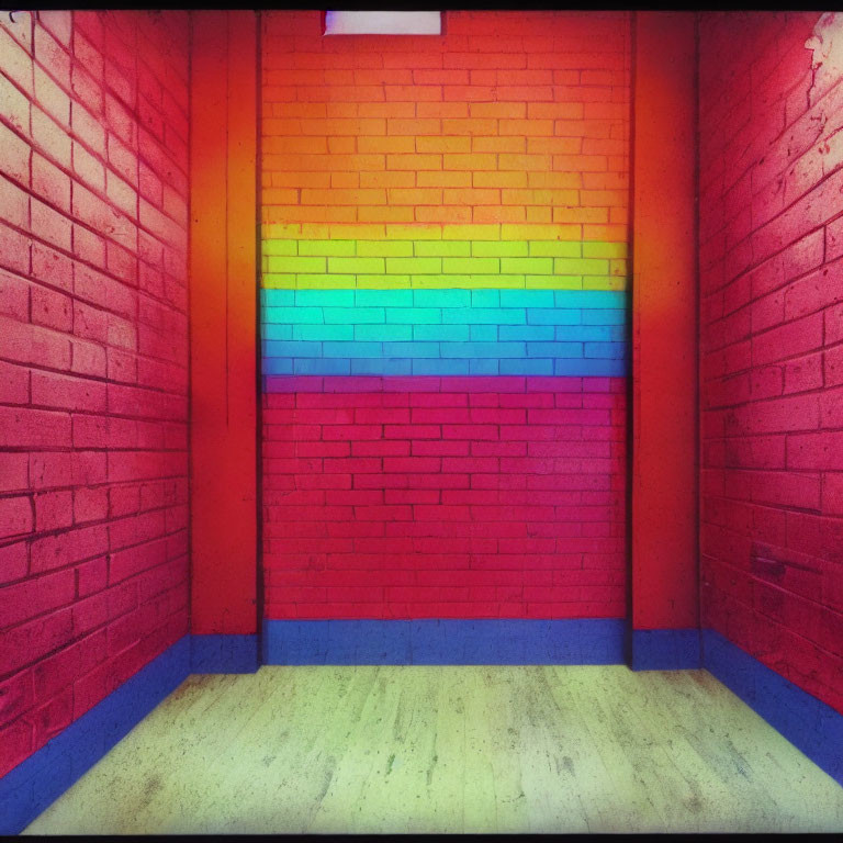 Colorful Rainbow Wall Transition with Blue Trim on Textured Floor