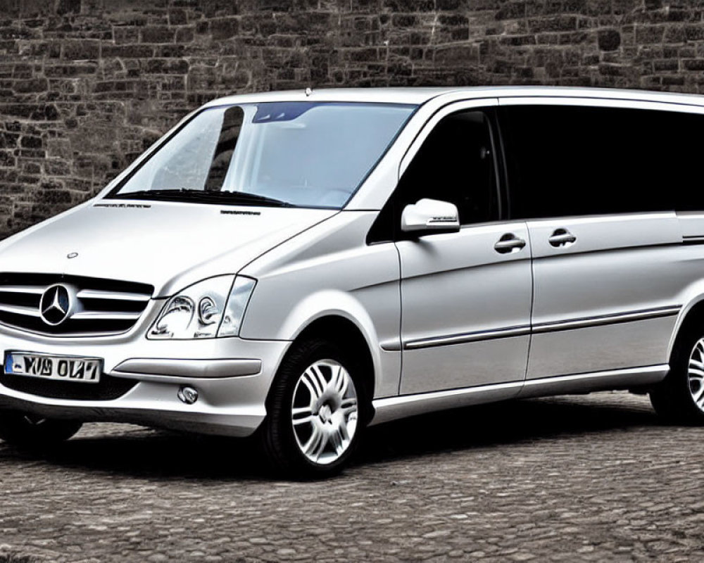 Silver Mercedes-Benz Viano Van Parked on Cobblestone Street