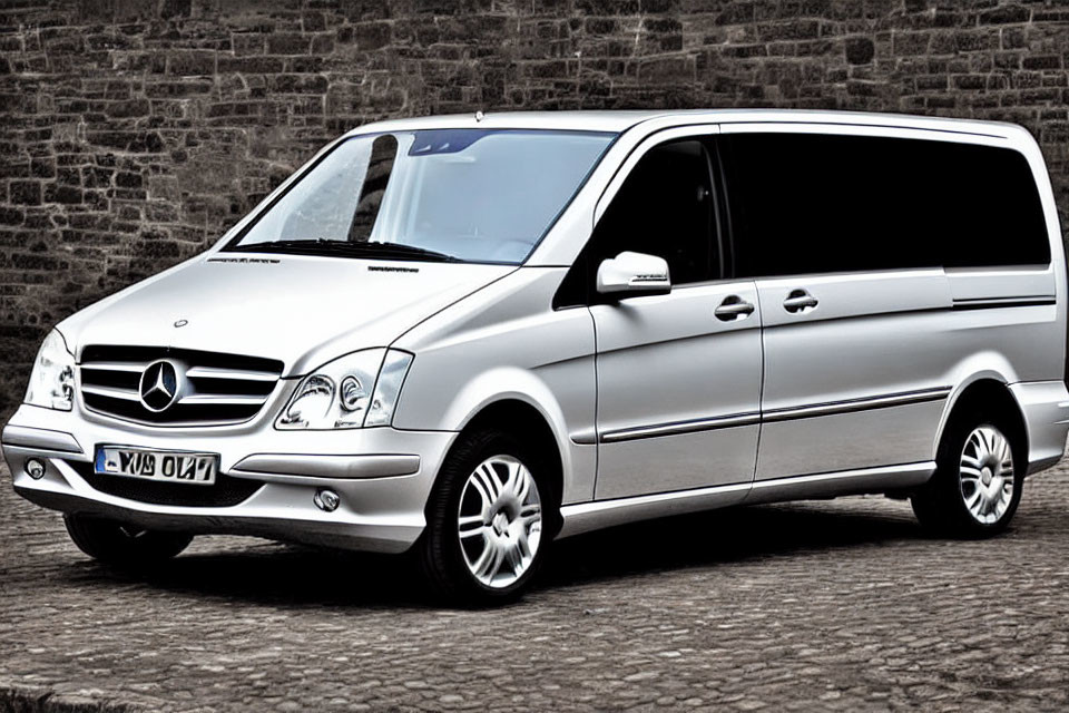 Silver Mercedes-Benz Viano Van Parked on Cobblestone Street