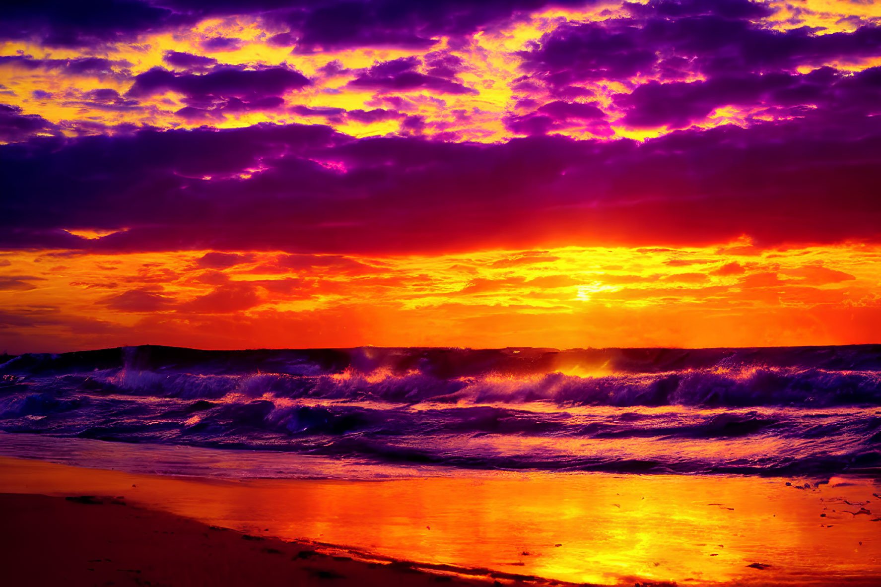 Intense purple and fiery orange sunset over ocean