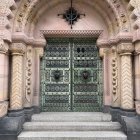 Colorful Psychedelic Patterned Door with Detailed Archway and Foliage