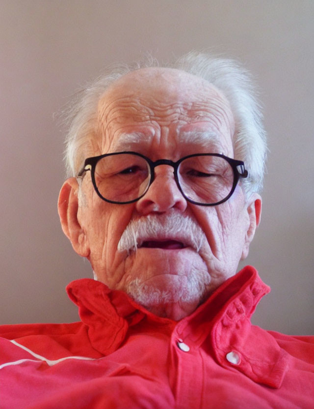 Elderly Man with White Facial Hair and Glasses in Red Shirt