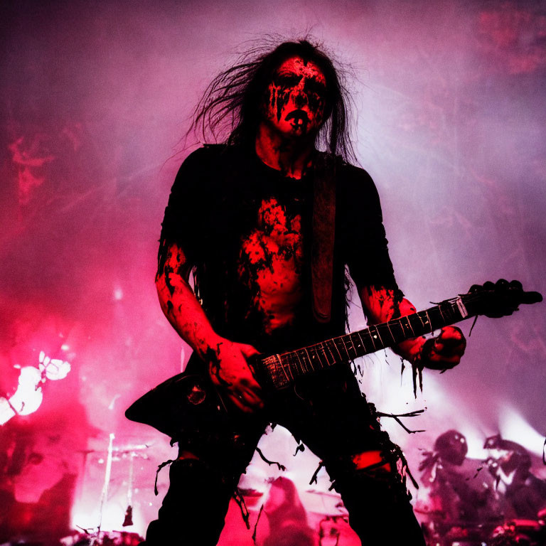 Black and Red Face Paint Guitarist in Intense Performance