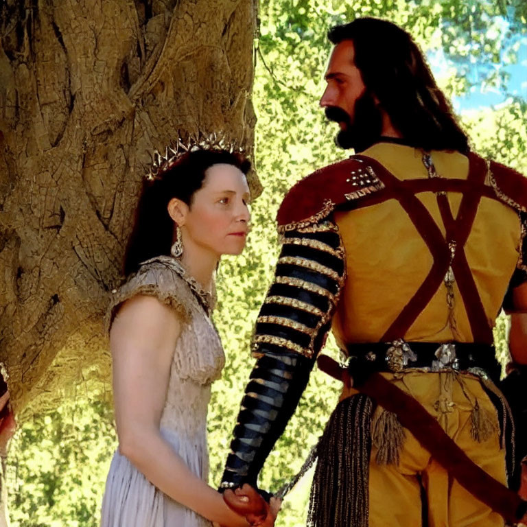 Woman in white dress and crown meets medieval warrior under tree in captivating gaze exchange