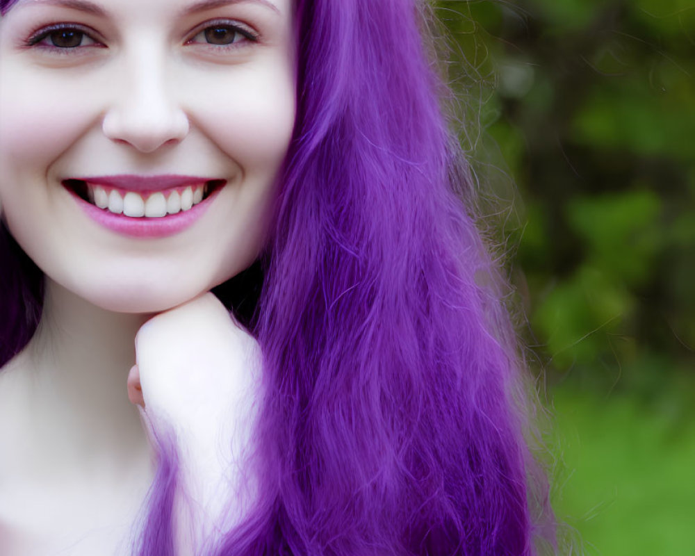 Smiling woman with purple hair in outdoor setting