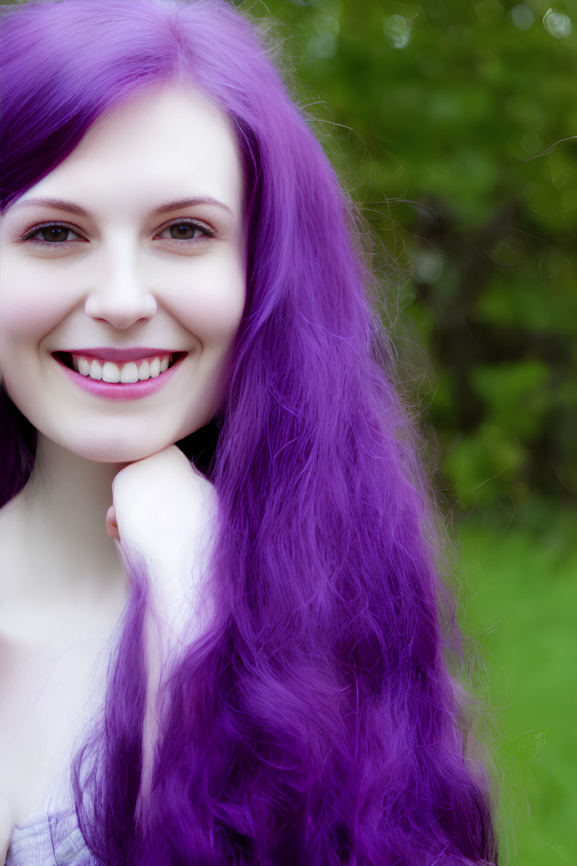 Smiling woman with purple hair in outdoor setting