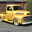 Vintage golden pickup truck parked on paved road near wooden barns under clear sky