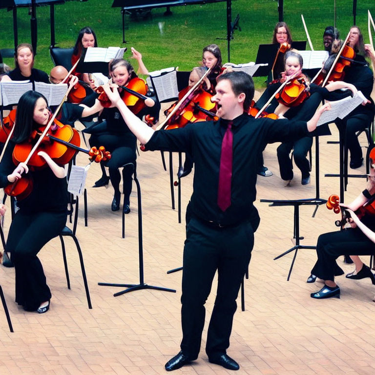 Outdoor orchestra performance by a conductor and violinists