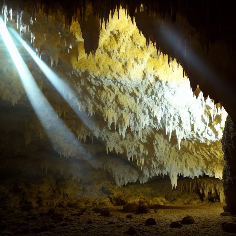 Stalactites in Cave with Illuminated Beams