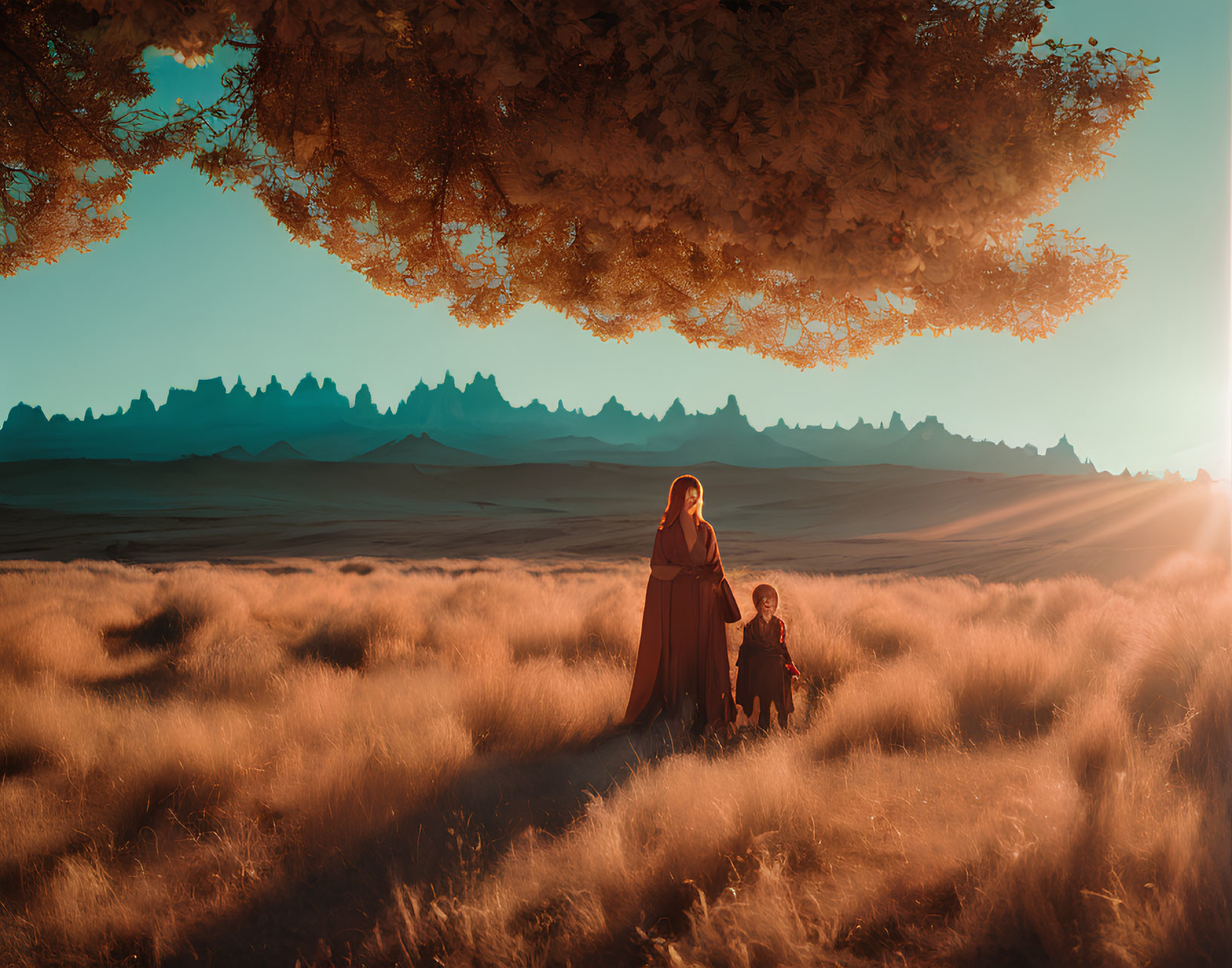 Vintage-clad woman and child under autumn tree in golden field with mountains and sunset sky