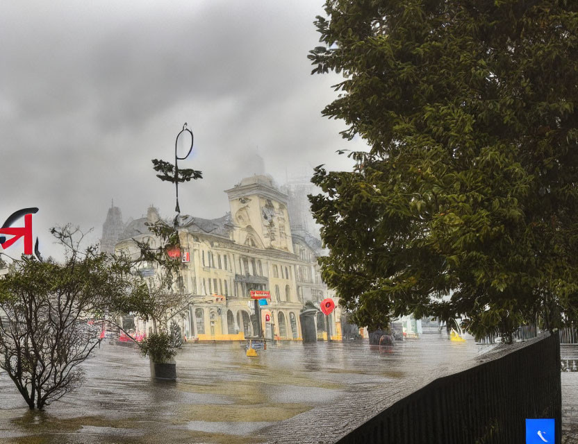 Rainy day scene with UK flag, vintage buildings, green trees, wet streets.