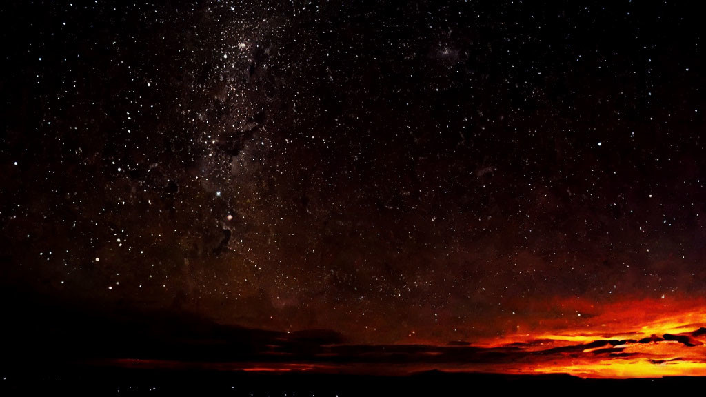 Starry Night Sky Transitions to Sunset Over Mountain Landscape