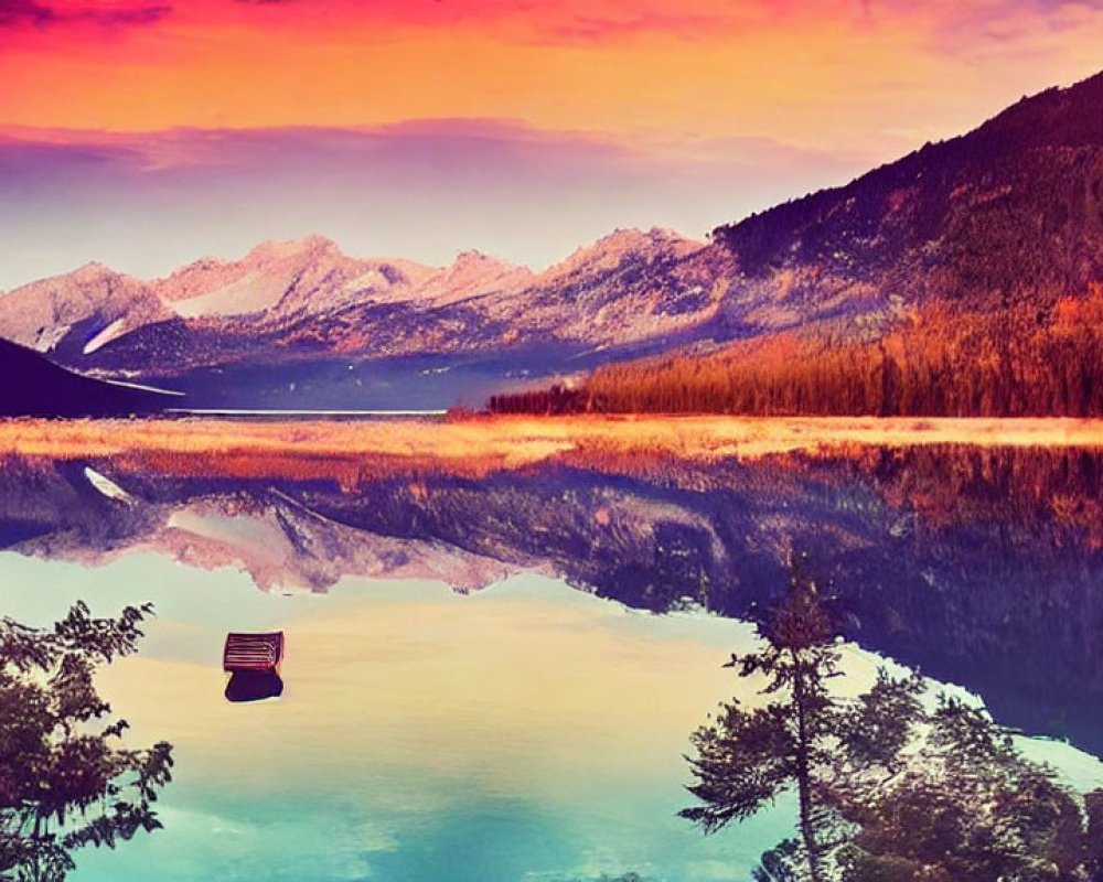 Scenic boat on calm lake with colorful skies and snowy peaks at dusk