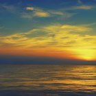 Tranquil sunset scene with colorful sky over calm sea