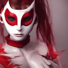 Person wearing red and white mask and makeup on muted background