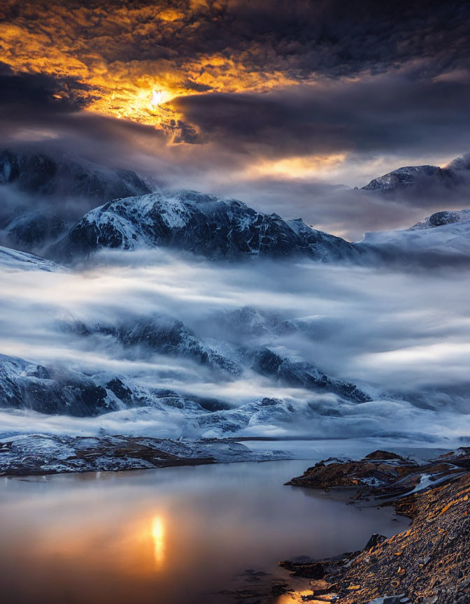 Sunlit Snow-Capped Mountains Reflecting in Tranquil Lake